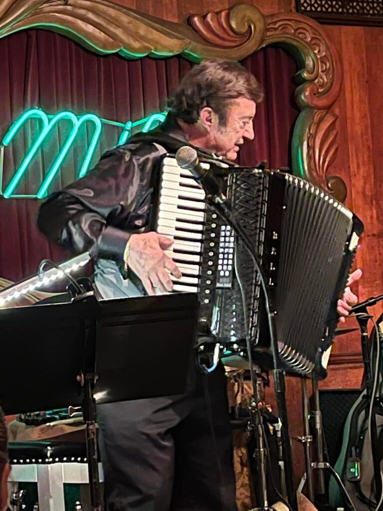 Joe Martino playing accordion live at a Chicago venue