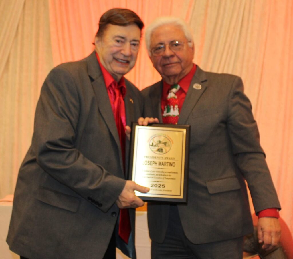 Joe Martino receiving a 2025 award plaque