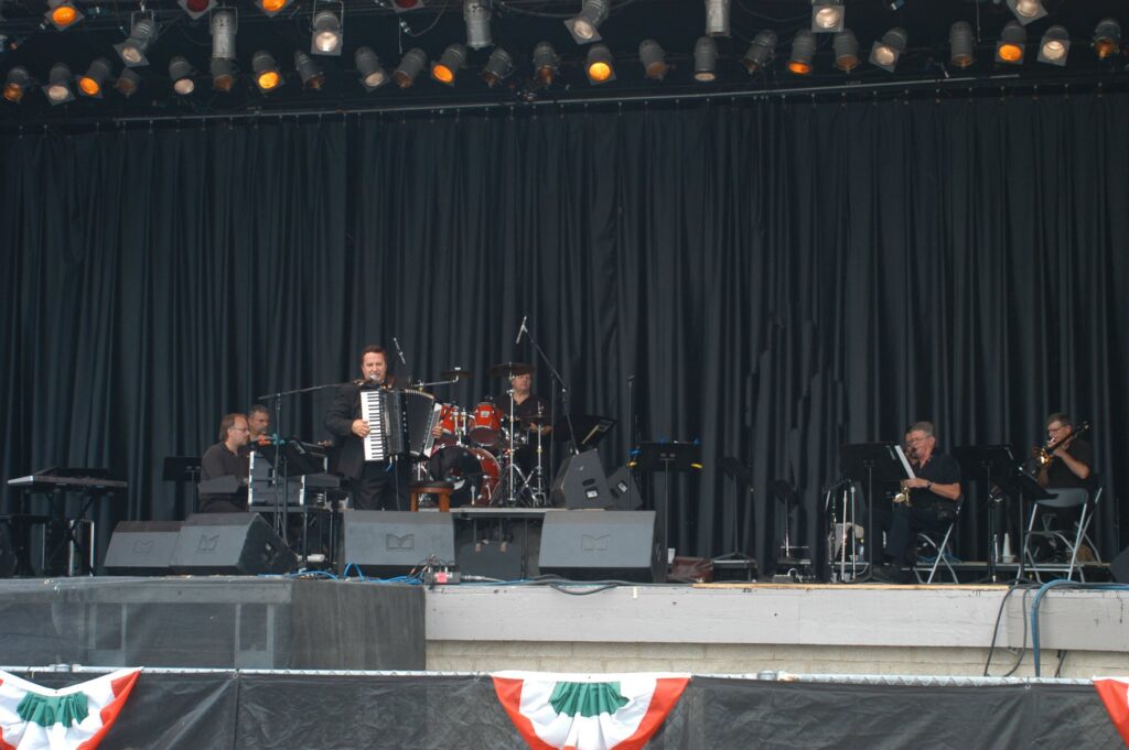 Joe Martino headlining a Festa Italiana main stage with a full band
